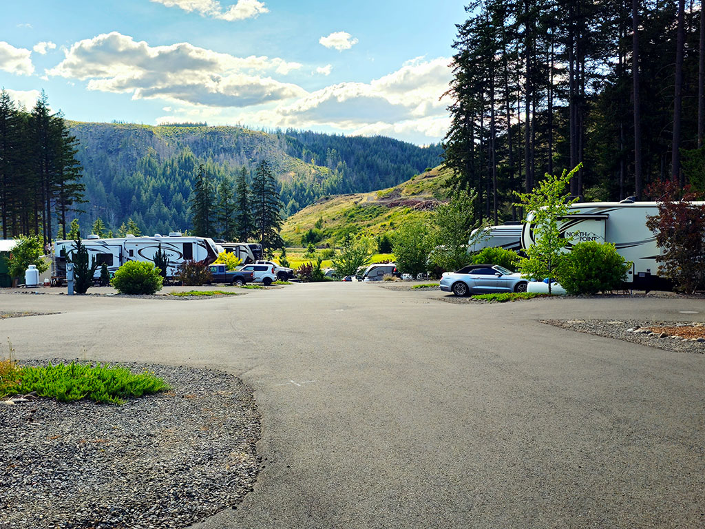 Paved roadway through RV sites with mountain views